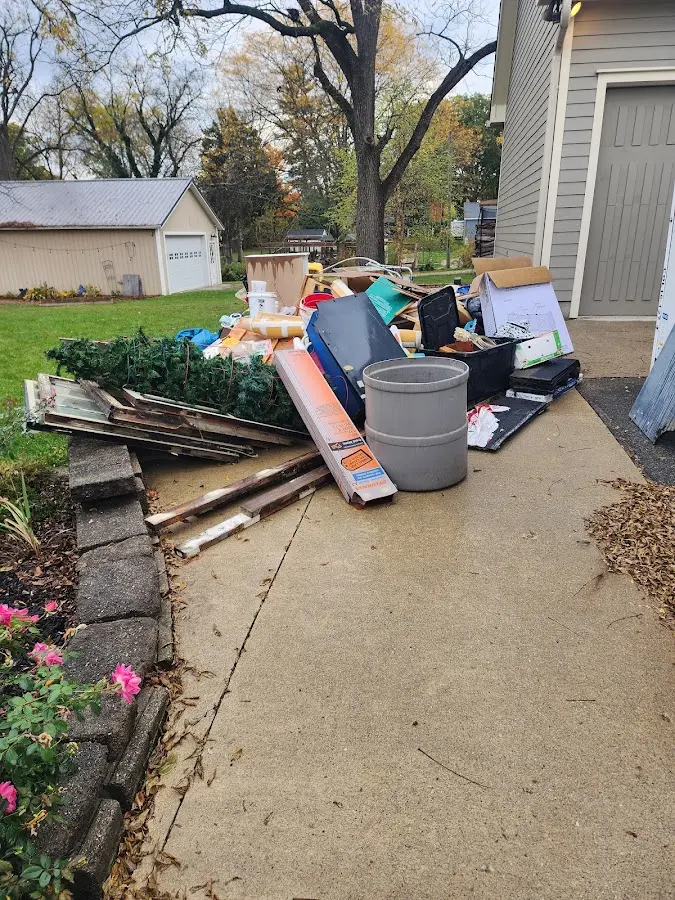 Dumpster being loaded with debris for 30 Yard Dumpster Rental in Scituate